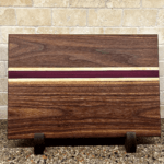 16"x11"x1" Walnut cutting board with birch and purple heart hightlights